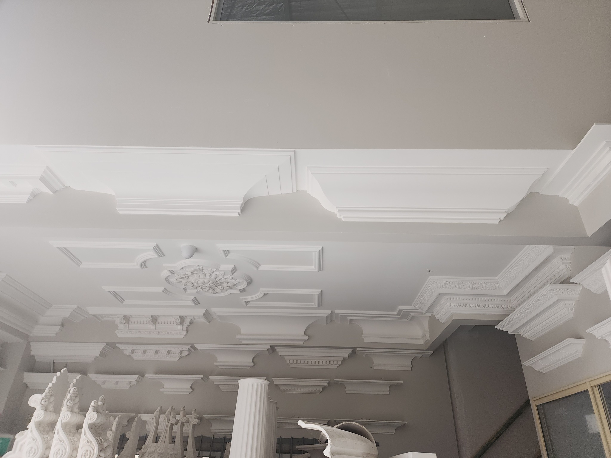 Ornate decorative cornice, corbels, columns and ceiling roses
